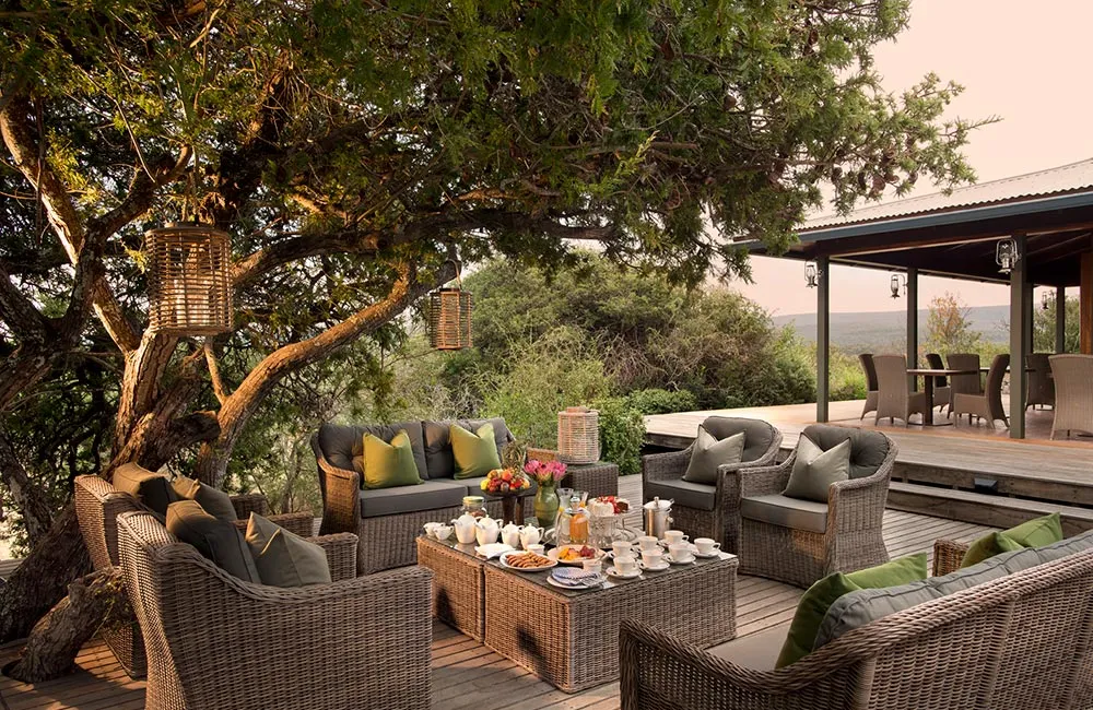 Wicker lounge with brightly coloured cushions