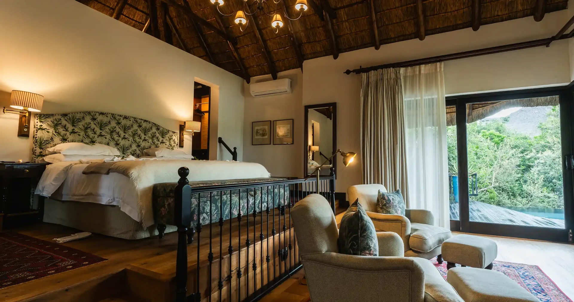 Kichaka Lodge lounge with chandelier and African artefacts