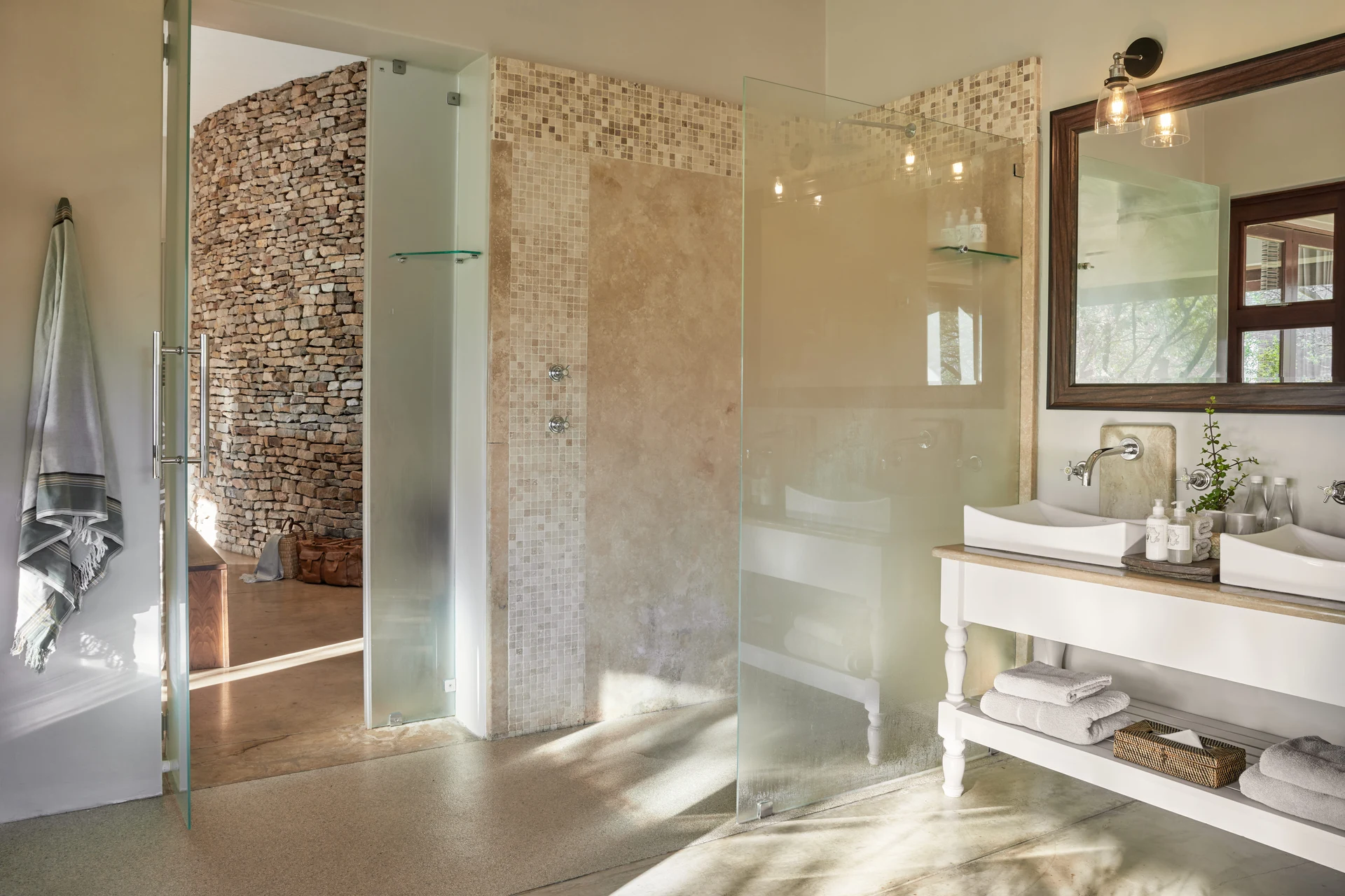 En-suite bathroom with walk-in shower and stone-feature wall