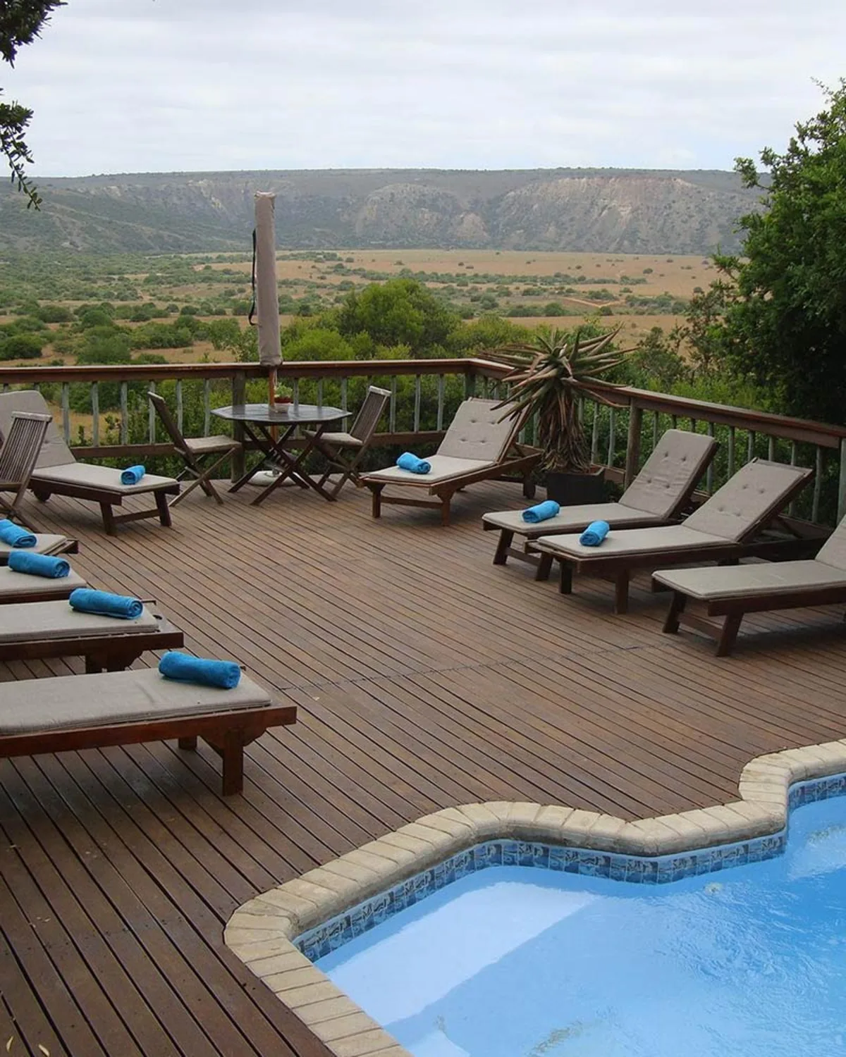Pool deck with loungers overlooking the valley